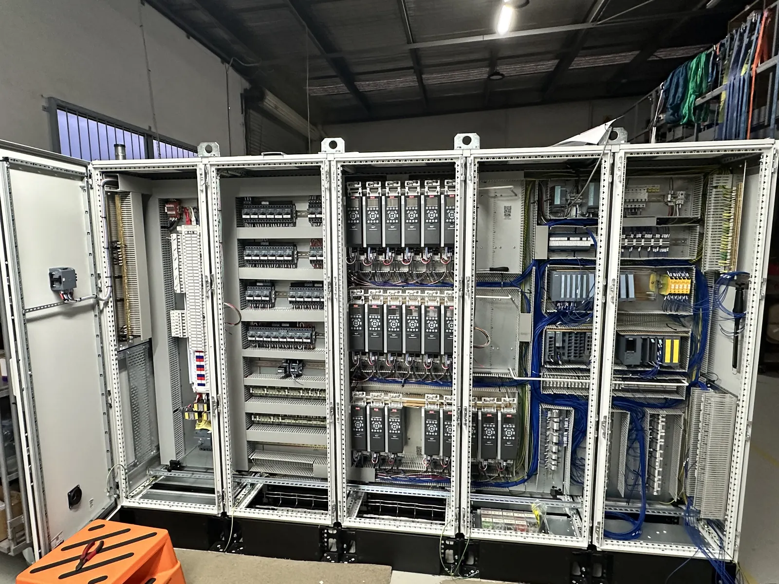 Industrial control cabinet with internal wiring and automation components