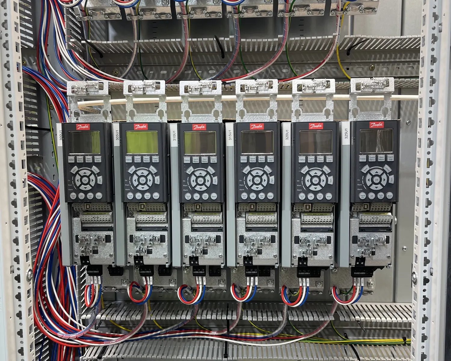 Variable speed drives and industrial control components inside an electrical cabinet